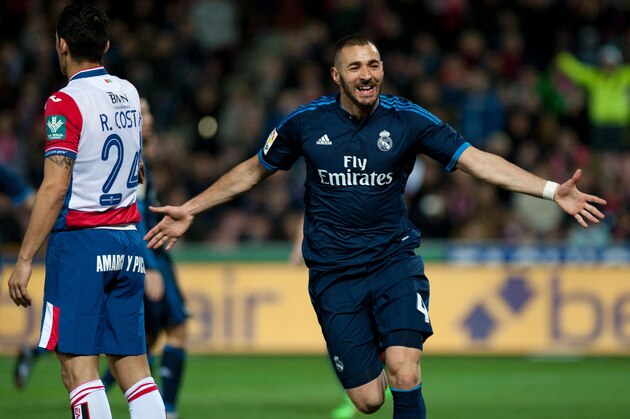 Real Madrid's French forward Karim Benzema celebrates a goal during the Spanish league football match Granada FC vs Real Madrid CF at Nuevo Los Carmenes stadium in Granada on February 7, 2016.   AFP PHOTO / JORGE GUERRERO / AFP / Jorge Guerrero        (Photo credit should read JORGE GUERRERO/AFP/Getty Images)