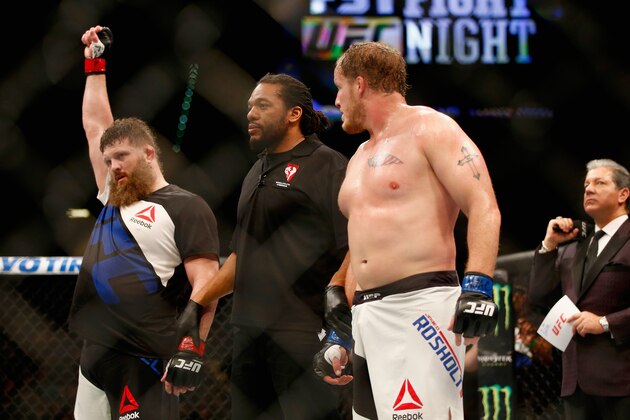 LAS VEGAS, NV - FEBRUARY 06:  (L-R) Roy Nelson celebrates after defeating Jared Rosholt in their heavyweight bout during the UFC Fight Night event at MGM Grand Garden Arena on February 6, 2016 in Las Vegas, Nevada.  (Photo by Jamie Squire /Zuffa LLC/Zuffa LLC via Getty Images)