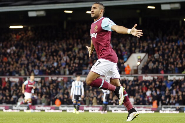 West Ham’s Dimitri Payet celebrates after scoring during the English Premier League soccer match between West Ham and Newcastle at Boleyn Ground in London, Monday, Sept. 14, 2015.(AP Photo/Frank Augstein)