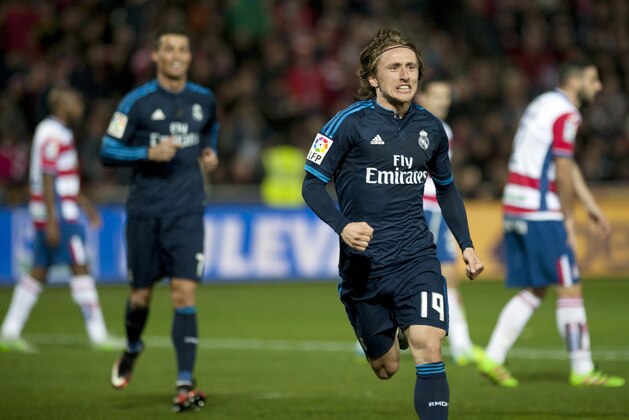 Real Madrid's Croatian midfielder Luka Modric celebrates a goal during the Spanish league football match Granada FC vs Real Madrid CF at Nuevo Los Carmenes stadium in Granada on February 7, 2016. AFP PHOTO / JORGE GUERRERO / AFP / Jorge Guerrero        (Photo credit should read JORGE GUERRERO/AFP/Getty Images)