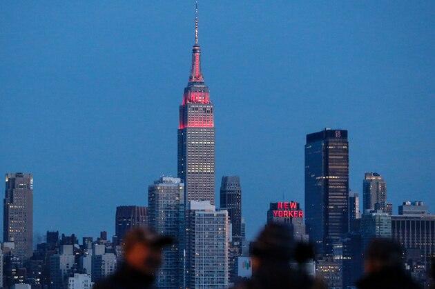 The Empire State Building in New York City is lit red and gold in honor of the Chinese Lunar New Year, aas seenfrom Weehawken, New Jersey, on February 6, 2016. 
 / AFP / KENA BETANCUR        (Photo credit should read KENA BETANCUR/AFP/Getty Images)