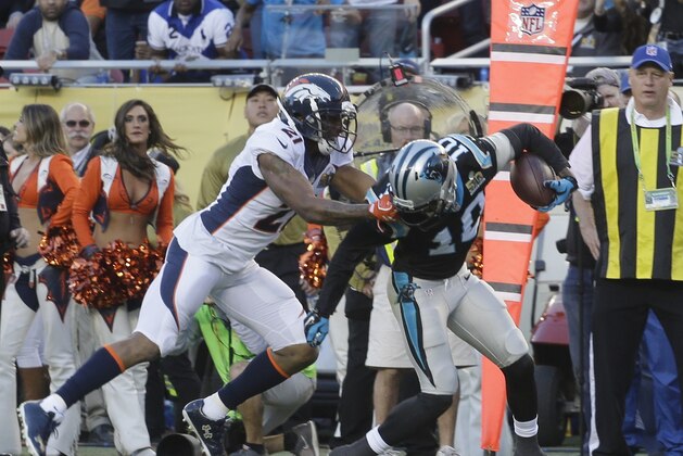 Denver Broncos’ Aqib Talib (21) tackles Carolina Panthers’ Corey Brown (10) after he caught a pass during the first half of the NFL Super Bowl 50 football game Sunday, Feb. 7, 2016, in Santa Clara, Calif. Talib was penalized for grabbing Brown's facemask. (AP Photo/Julie Jacobson)