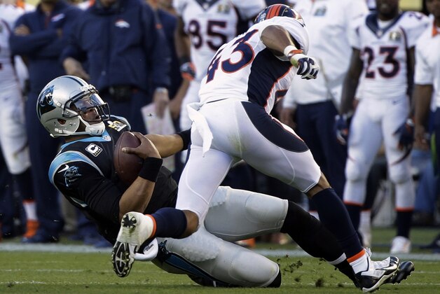 Carolina Panthers’ Cam Newton (1) is tackled by Denver Broncos’ T.J. Ward (43) during the first half of the NFL Super Bowl 50 football game Sunday, Feb. 7, 2016, in Santa Clara, Calif. (AP Photo/Julie Jacobson)