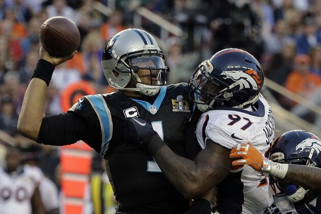 Carolina Panthers’ Cam Newton (1) tries to throw with Denver Broncos’ Malik Jackson (97) defending during the first half of the NFL Super Bowl 50 football game Sunday, Feb. 7, 2016, in Santa Clara, Calif. (AP Photo/Gregory Bull)