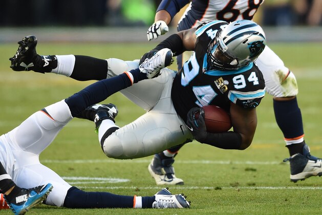 Kony Ealy (#94) of the Carolina Panthers tumbles with the ball during Super Bowl 50 against the Denver Broncos at Levi's Stadium in Santa Clara, California February 7, 2016. / AFP / TIMOTHY A. CLARY        (Photo credit should read TIMOTHY A. CLARY/AFP/Getty Images)
