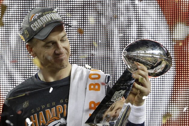 Denver Broncos’ Peyton Manning (18) holds up the trophy after the NFL Super Bowl 50 football game Sunday, Feb. 7, 2016, in Santa Clara, Calif. The Broncos beat the Panthers 24-10.  (AP Photo/Marcio Jose Sanchez)