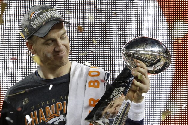 Denver Broncos’ Peyton Manning (18) holds up the trophy after the NFL Super Bowl 50 football game Sunday, Feb. 7, 2016, in Santa Clara, Calif. The Broncos beat the Panthers 24-10.  (AP Photo/Marcio Jose Sanchez)