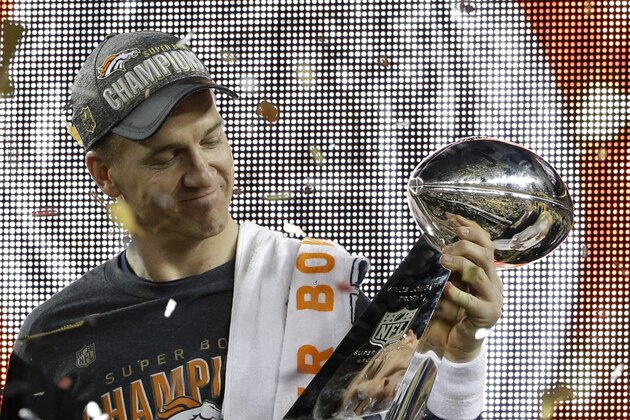 Denver Broncos’ Peyton Manning (18) holds up the trophy after the NFL Super Bowl 50 football game Sunday, Feb. 7, 2016, in Santa Clara, Calif. The Broncos beat the Panthers 24-10.  (AP Photo/Marcio Jose Sanchez)