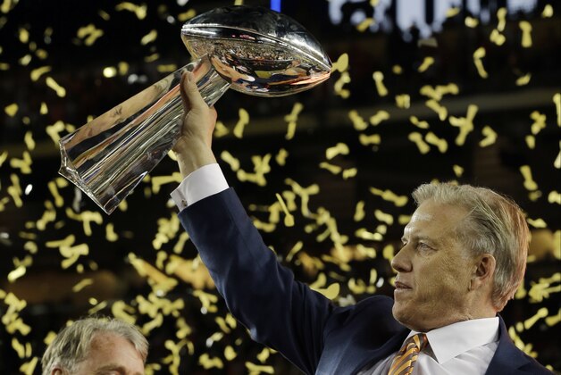 John Elway, General Manager and Executive Vice President of Football Operations for the Denver Broncos, holds the championship trophy after the NFL Super Bowl 50 football game Carolina Panthers Sunday, Feb. 7, 2016, in Santa Clara, Calif. The Broncos won 24-10. (AP Photo/David J. Phillip)