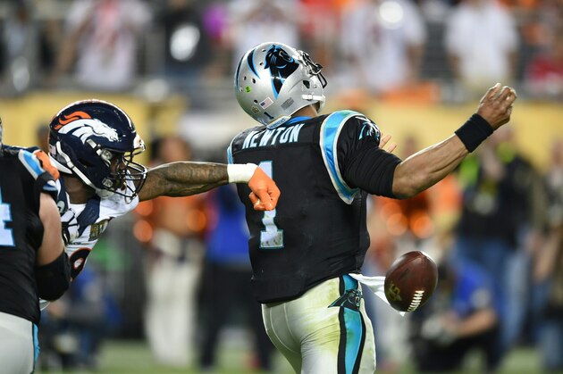 Denver Bronco Von Miller (L) forces Carolina Panther quarterback Cam Newton to fumble the ball during Super Bowl 50 at Levi's Stadium in Santa Clara, California February 7, 2016. / AFP / TIMOTHY A. CLARY        (Photo credit should read TIMOTHY A. CLARY/AFP/Getty Images)