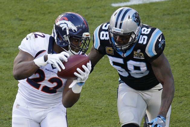 Denver Broncos’  C.J. Anderson (22) catches a pass in front of Carolina Panthers’ Thomas Davis (58) during the first half of the NFL Super Bowl 50 football game Sunday, Feb. 7, 2016, in Santa Clara, Calif. (AP Photo/Charlie Riedel)