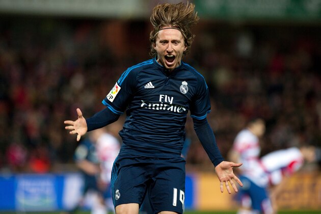 Real Madrid's Croatian midfielder Luka Modric celebrates a goal during the Spanish league football match Granada FC vs Real Madrid CF at Nuevo Los Carmenes stadium in Granada on February 7, 2016. AFP PHOTO / JORGE GUERRERO / AFP / Jorge Guerrero        (Photo credit should read JORGE GUERRERO/AFP/Getty Images)
