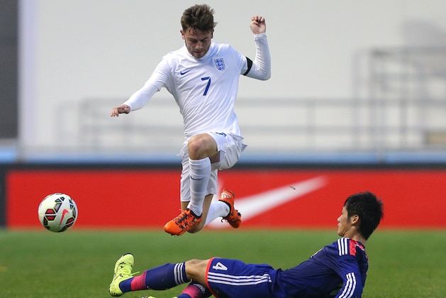 MANCHESTER, ENGLAND - NOVEMBER 15: Patrick Roberts of England is tackled by Reiya Morishita of Japan during the U19 International friendly match between England and Japan at Manchester City Academy Stadium on November 15, 2015 in Manchester, England. (Photo by Dave Thompson/Getty Images)