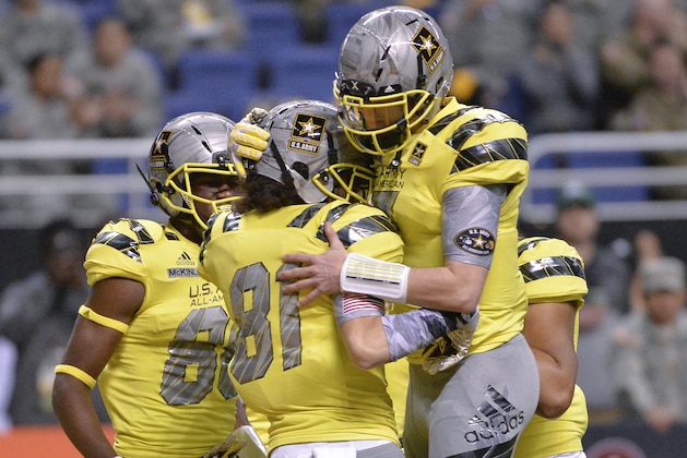 West wide receiver Simi Fehoko (81) celebrates a touchdown with West quarterback Shea Patterson during the first half of the Army All American Bowl high school football game against the East, Saturday, Jan. 9, 2016, in San Antonio. (AP Photo/Darren Abate)