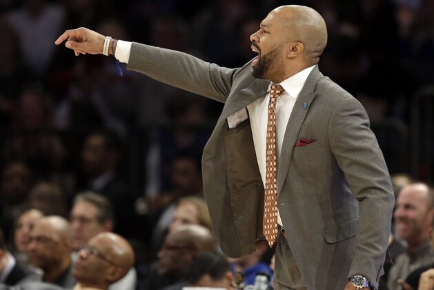 New York Knicks head coach Derek Fisher talks to his players during the second half of the NBA basketball game against the Denver Nuggets, Sunday, Feb. 7, 2016, in New York. The Nuggets defeated the Knicks 101-96. (AP Photo/Seth Wenig)