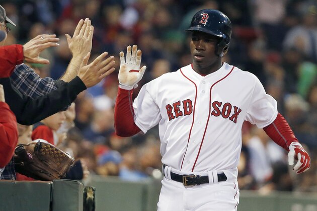 Boston Red Sox's Rusney Castillo celebrates after scoring during the eighth inning of a baseball game against the Baltimore Orioles in Boston, Saturday, Sept. 26, 2015. (AP Photo/Michael Dwyer)
