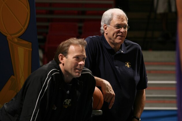 ORLANDO, FL - JUNE 13: Phil Jackson, head coach of the Los Angeles Lakers and assistant coach Kurt Rambis run practice before Game Five of the NBA Finals against the Orlando Magic at Amway Center on June 13, 2009 in Orlando, Florida. The Lakers lead the series 3 games to 1. NOTE TO USER: User expressly acknowledges and agrees that, by downloading and/or using this Photograph, user is consenting to the terms and conditions of the Getty Images License Agreement. Mandatory Copyright Notice: Copyright 2009 NBAE (Photo by Nathaniel S. Butler/NBAE via Getty Images)