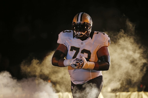 New Orleans Saints guard Jahri Evans (73) walks onto the field during player introductions before an NFL football game in New Orleans, Sunday, Sept. 20, 2015. (AP Photo/Jonathan Bachman)