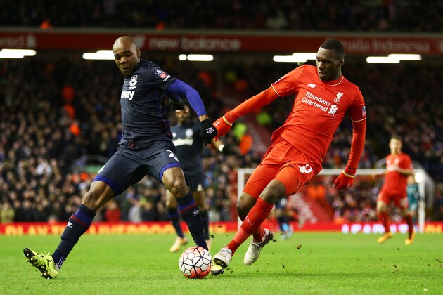 LIVERPOOL, ENGLAND - JANUARY 30:  Angelo Ogbonna Obinza of West Ham United battles with Christian Benteke of Liverpool during the Emirates FA Cup Fourth Round match between Liverpool and West Ham United at Anfield on January 30, 2016 in Liverpool, England.  (Photo by Clive Brunskill/Getty Images)