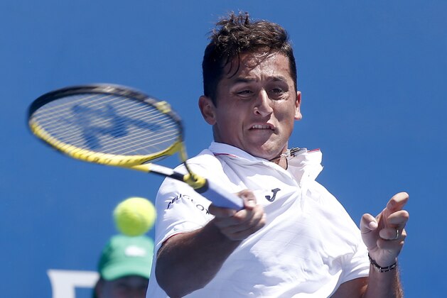 Nicolas Almagro of Spain makes a forehand return to Dominic Thiem of Austria during their second round match at the Australian Open tennis championships in Melbourne, Australia, Wednesday, Jan. 20, 2016.(AP Photo/Rafiq Maqbool)