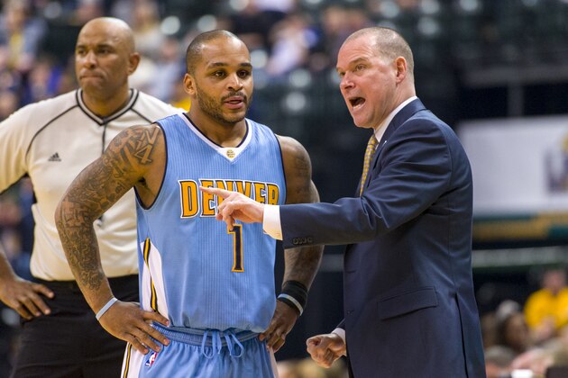 Denver Nuggets head coach Michael Malone, right, talks with guard Jameer Nelson (1) during a break in the first half of an NBA basketball game against the Indiana Pacers, Saturday, Jan. 30, 2016, in Indianapolis. (AP Photo/Doug McSchooler)