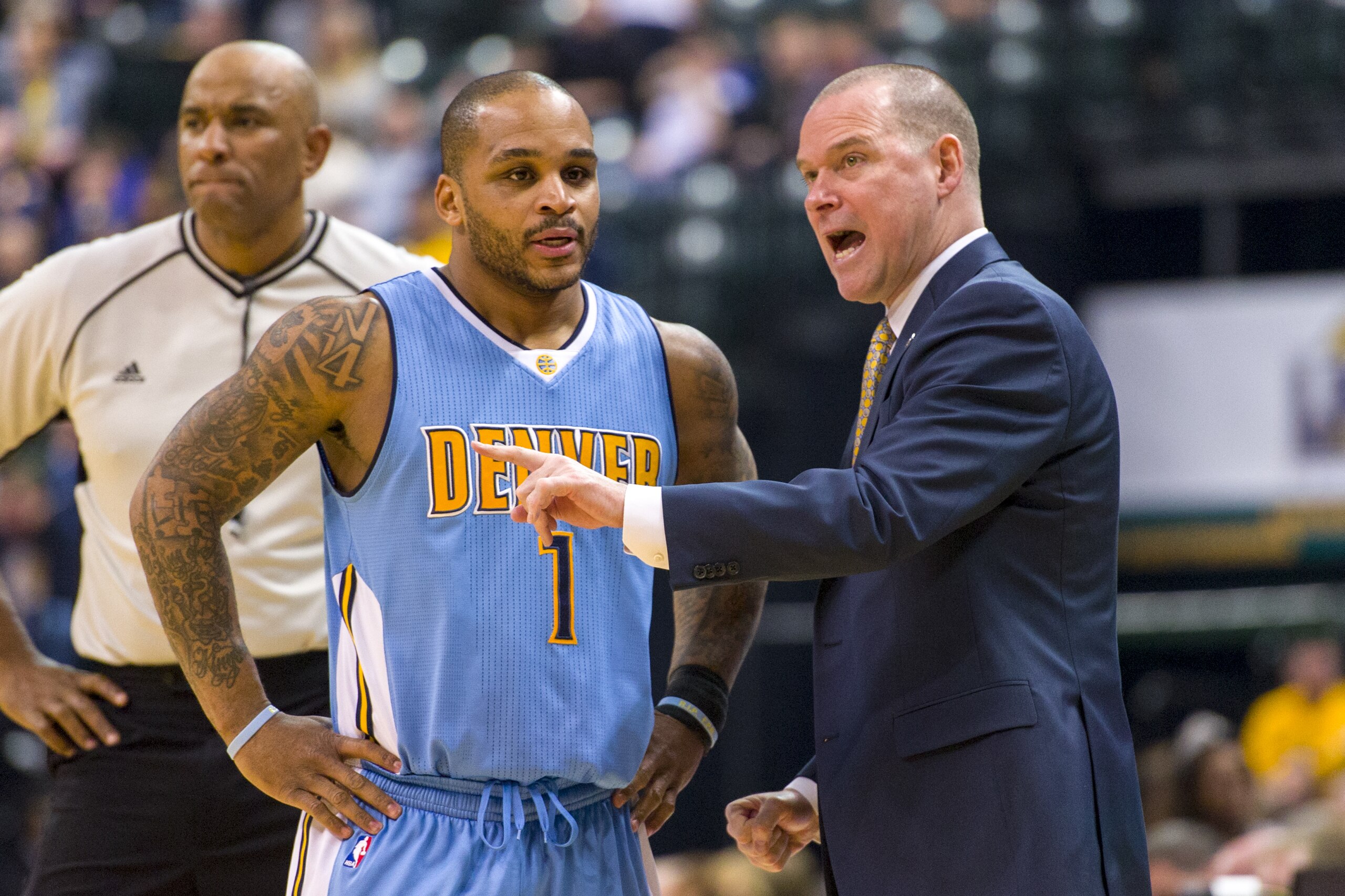 Denver Nuggets head coach Michael Malone, right, talks with guard Jameer Nelson (1) during a break in the first half of an NBA basketball game against the Indiana Pacers, Saturday, Jan. 30, 2016, in Indianapolis. (AP Photo/Doug McSchooler)