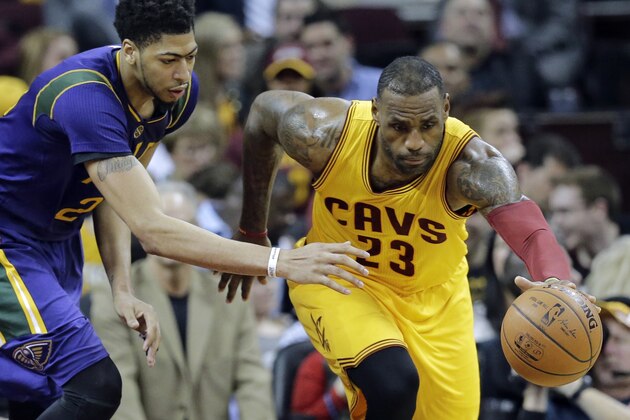 Cleveland Cavaliers' LeBron James, right, steals the ball from New Orleans Pelicans' Anthony Davis in the second half of an NBA basketball game Saturday, Feb. 6, 2016, in Cleveland. The Cavaliers won 99-84. (AP Photo/Tony Dejak)