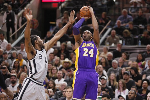 Feb 6, 2016; San Antonio, TX, USA; Los Angeles Lakers small forward Kobe Bryant (24) shoots the ball over San Antonio Spurs small forward Kawhi Leonard (2) during the first half at AT&T Center. Mandatory Credit: Soobum Im-USA TODAY Sports