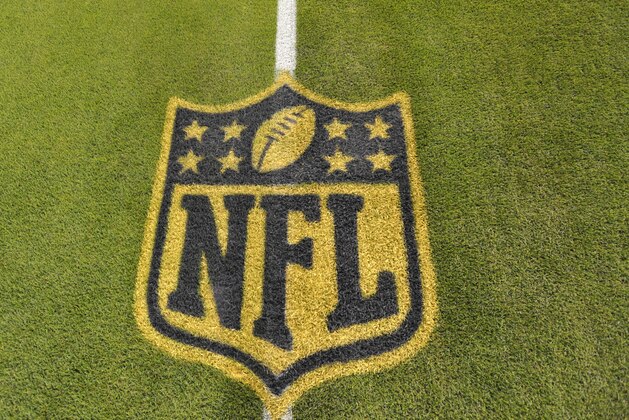 A general view of an NFL logo on the 50-yard line prior to an NFL football game between the Cleveland Browns and the Baltimore Ravens Monday, Nov. 30, 2015, in Cleveland. Baltimore won 33-27. (AP Photo/David Richard)