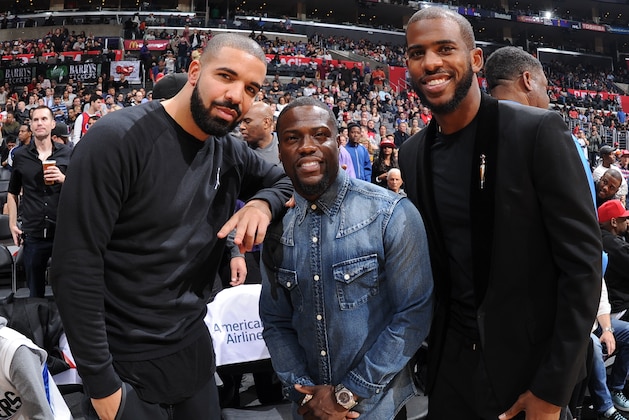 LOS ANGELES, CA - NOVEMBER 07:  Drake and Kevin Hart smile with Chris Paul #3 of the Los Angeles Clippers at STAPLES Center on November 07, 2015 in Los Angeles, California. NOTE TO USER: User expressly acknowledges and agrees that, by downloading and/or using this Photograph, user is consenting to the terms and conditions of the Getty Images License Agreement. Mandatory Copyright Notice: Copyright 2015 NBAE (Photo by Andrew D. Bernstein/NBAE via Getty Images)