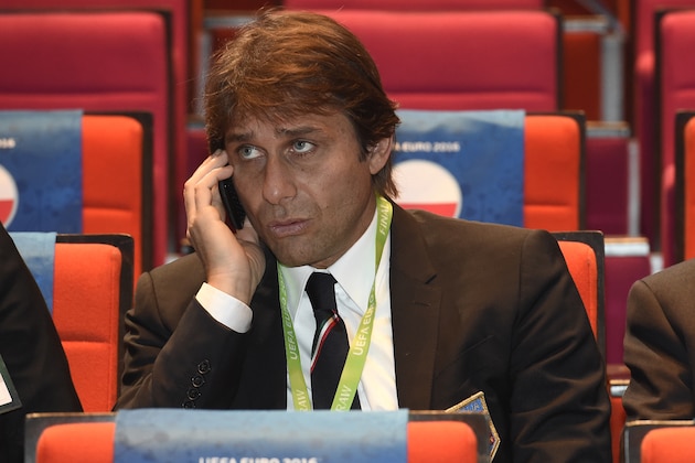Italy's coach Antonio Conte talks on his mobile phone before the start of the final draw of the UEFA Euro 2016 football tournament in Paris on December 12, 2015.  AFP PHOTO / LIONEL BONAVENTURE / AFP / LIONEL BONAVENTURE        (Photo credit should read LIONEL BONAVENTURE/AFP/Getty Images)