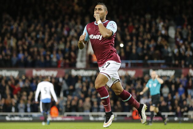 West Ham’s Dimitri Payet celebrates after scoring during the English Premier League soccer match between West Ham and Newcastle at Boleyn Ground in London, Monday, Sept. 14, 2015.(AP Photo/Frank Augstein)