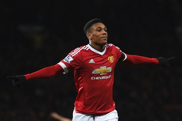 Manchester United's French striker Anthony Martial celebrates scoring their second goal during the English Premier League football match between Manchester United and Stoke City at Old Trafford in Manchester, north west England, on February 2, 2016. / AFP / PAUL ELLIS / RESTRICTED TO EDITORIAL USE. No use with unauthorized audio, video, data, fixture lists, club/league logos or 'live' services. Online in-match use limited to 75 images, no video emulation. No use in betting, games or single club/league/player publications.  /         (Photo credit should read PAUL ELLIS/AFP/Getty Images)