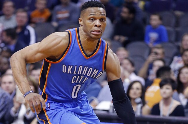 Oklahoma City Thunder's Russell Westbrook dribbles the ball against the Phoenix Suns during the first half of an NBA basketball game Monday, Feb. 8, 2016, in Phoenix. (AP Photo/Ross D. Franklin)