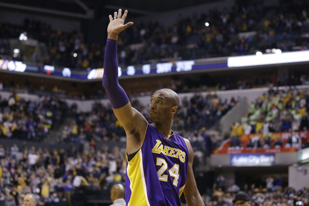 Los Angeles Lakers forward Kobe Bryant (24) waves to fans as he leaves the game in the final seconds of the second half of an NBA basketball game against the Indiana Pacers in Indianapolis, Monday, Feb. 8, 2016. The Pacers defeated the Lakers 89-87. (AP Photo/Michael Conroy)