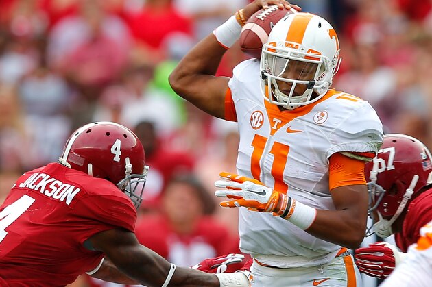 TUSCALOOSA, AL - OCTOBER 24:  Joshua Dobbs #11 of the Tennessee Volunteers is sacked by D.J. Pettway #57 and Eddie Jackson #4 of the Alabama Crimson Tide at Bryant-Denny Stadium on October 24, 2015 in Tuscaloosa, Alabama.  (Photo by Kevin C. Cox/Getty Images)