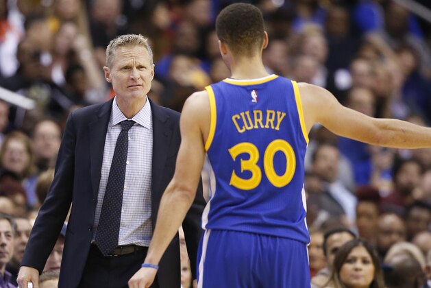 Golden State Warriors head coach Steve Kerr and Golden State Warriors guard Stephen Curry (30) talk in the second half of an NBA basketball game Washington Wizards, Wednesday, Feb. 3, 2016, in Washington. The Warriors won 134-121. (AP Photo/Alex Brandon)