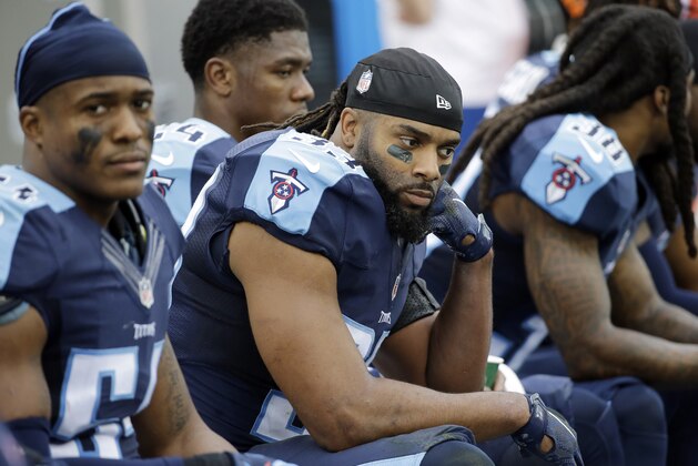 Tennessee Titans safety Michael Griffin, center, sits on the bench in the final minutes of the fourth quarter during their 34-6 loss to the Houston Texans in an NFL football game Sunday, Dec. 27, 2015, in Nashville, Tenn. (AP Photo/James Kenney)