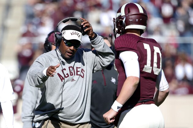 Texas A&M head coach Kevin Sumlin, left, greets quarterback Kyle Allen (10) at the sideline after the Aggies scored against Louisiana Monroe in the first half of an NCAA college football game, Saturday, Nov. 1, 2014, in College Station, Texas. (AP Photo/Tony Gutierrez)