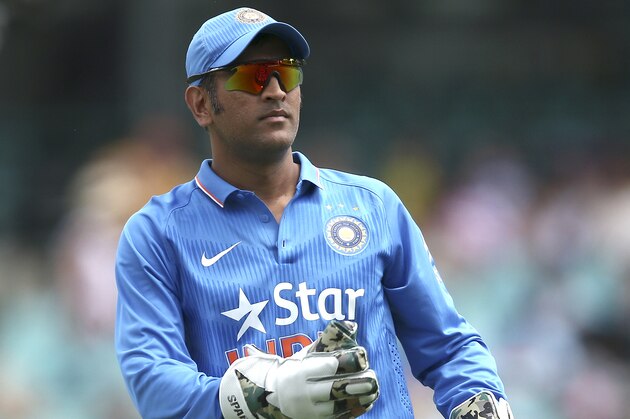 India's captain MS Dhoni throws the ball during a One Day International cricket match against Australia in Sydney Saturday, Jan. 23, 2016. (AP Photo/Rob Griffith)