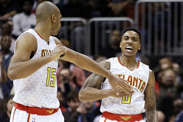 Atlanta Hawks' Jeff Teague, right, celebrates with teammate Al Horford after scoring in the final minute of an NBA basketball game against the Oklahoma City Thunder, Monday, Nov. 30, 2015, in Atlanta. The Hawks won 106-100. (AP Photo/David Goldman)