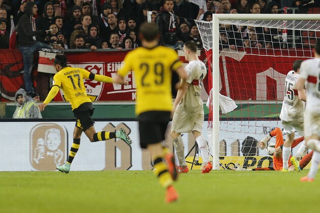 Dortmund's Pierre-Emerick Aubameyang, left, has scored his side's second goal during a quarterfinal match of the German soccer cup between VfB Stuttgart and Borussia Dortmund in Stuttgart, Germany, Tuesday, Feb. 9, 2016. (AP Photo/Michael Probst)