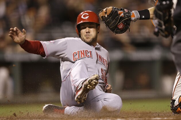 Cincinnati Reds' Skip Schumaker is tagged out at home plate by San Francisco Giants' Buster Posey during the seventh inning of a baseball game Tuesday, Sept. 15, 2015, in San Francisco. (AP Photo/Ben Margot)