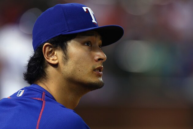 ARLINGTON, TX - AUGUST 26:  Yu Darvish #11 of the Texas Rangers looks on as the Rangers take on the Toronto Blue Jays in the bottom of the fourth inning at Globe Life Park in Arlington on August 26, 2015 in Arlington, Texas.  (Photo by Tom Pennington/Getty Images)