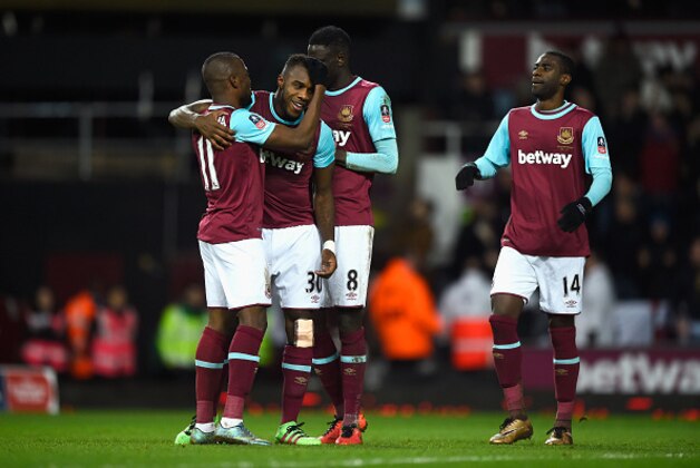 LONDON, ENGLAND - FEBRUARY 09:  Michail Antonio of West Ham United (2L) celebrates with team mates as he scores their first goal during the Emirates FA Cup Fourth Round Replay match between West Ham United and Liverpool at Boleyn Ground on February 9, 2016 in London, England.  (Photo by Mike Hewitt/Getty Images)