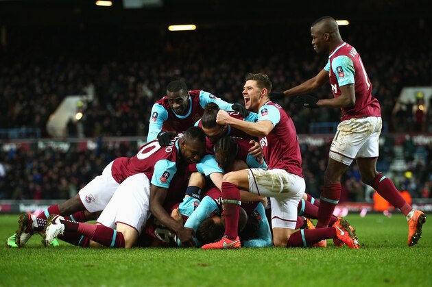 LONDON, ENGLAND - FEBRUARY 09:  Angelo Ogbonna Obinza of West Ham United is mobbed in celebration by team mates as he scores their second goal during the Emirates FA Cup Fourth Round Replay match between West Ham United and Liverpool at Boleyn Ground on February 9, 2016 in London, England.  (Photo by Clive Rose/Getty Images)
