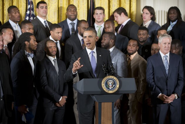 President Barack Obama, center, welcomes the NFL champion Seattle Seahawks football team to the East Room of the White House in Washington, Wednesday, May 21, 2014. The Seahawks defeated the Denver Broncos in Super Bowl XLVIII. (AP Photo/Pablo Martinez Monsivais)