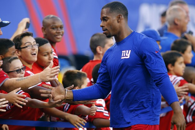 Aug 22, 2015; East Rutherford, NJ, USA; New York Giants wide receiver Victor Cruz (80) shakes hands of Giants fans before the start of game against the Jacksonville Jaguars at MetLife Stadium. Mandatory Credit: Noah K. Murray-USA TODAY Sports