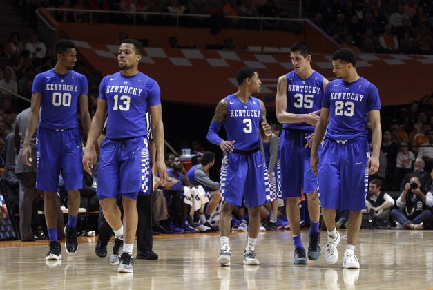 Kentucky forward Marcus Lee (00), guard Tyler Ulis (3), forward Derek Willis (35) and guard Jamal Murray (23) walk onto the court after a timeout during the second half of an NCAA college basketball game against Tennessee on Tuesday, Feb. 2, 2016, in Knoxville, Tenn. Tennessee won 84-77. (AP Photo/Wade Payne)