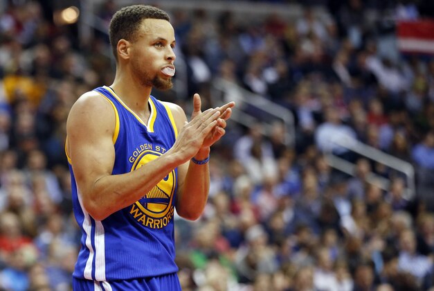 Feb 3, 2016; Washington, DC, USA; Golden State Warriors guard Stephen Curry (30) claps while standing on the court against the Washington Wizards in the fourth quarter at Verizon Center. The Warriors won 134-121. Mandatory Credit: Geoff Burke-USA TODAY Sports